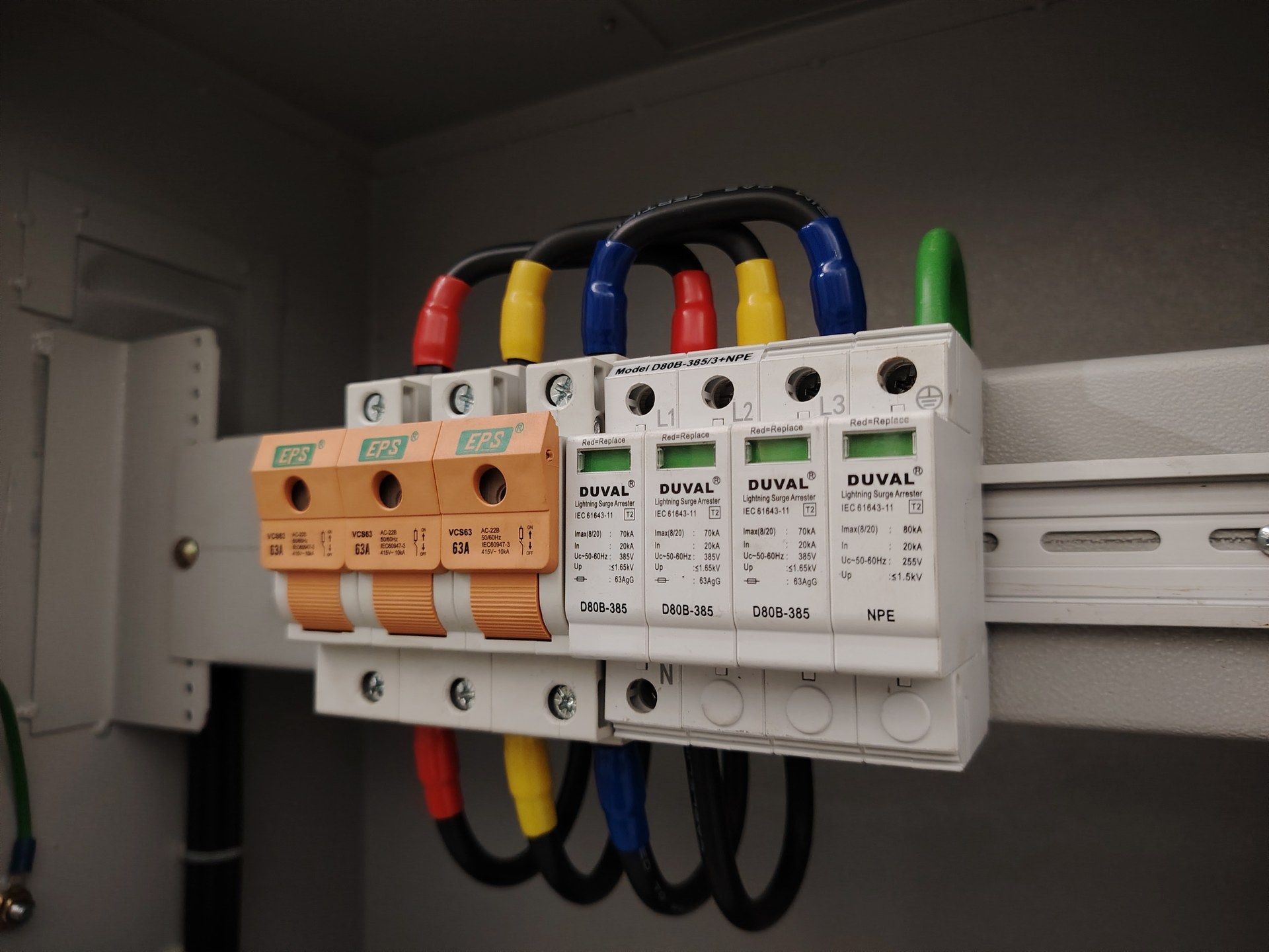 Surge protective devices installed in an electrical distribution panel with three-phase power connections