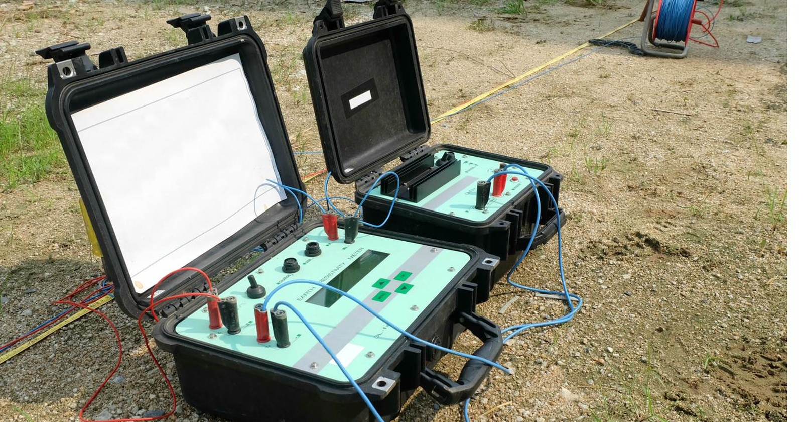 Earth resistivity meters set up in the field for an earthing test